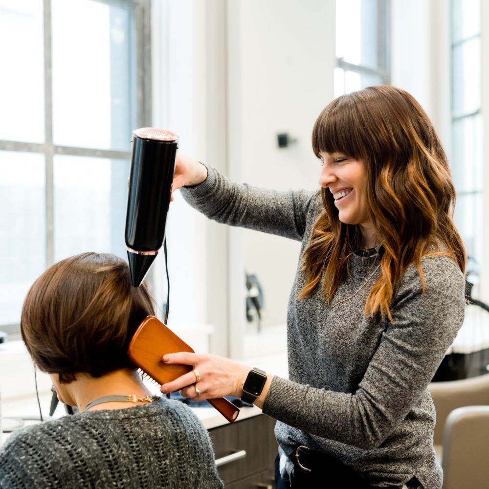 Hairdresser dying womans hair