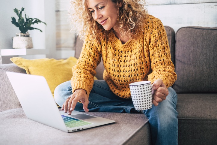 WI_Woman on computer with cup of coffee